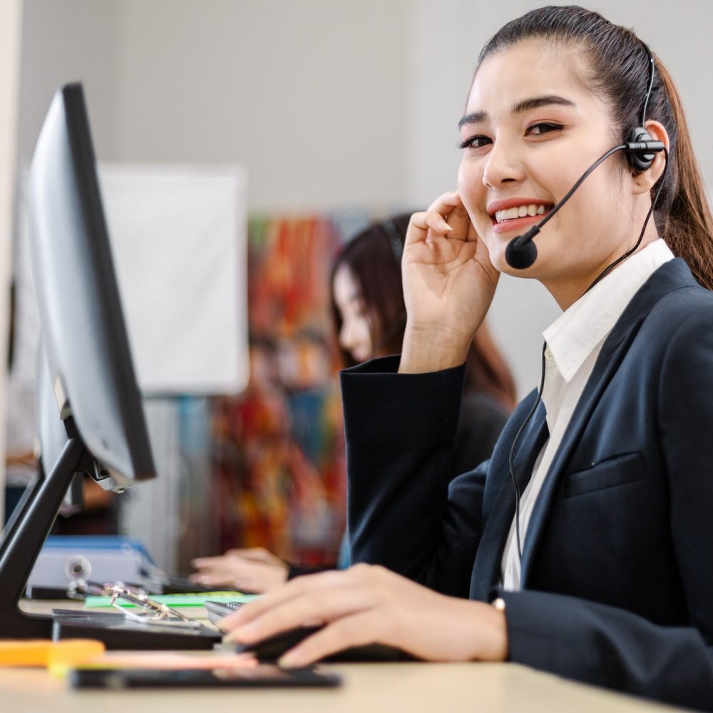 asian-call-operator-working-at-desk.jpg